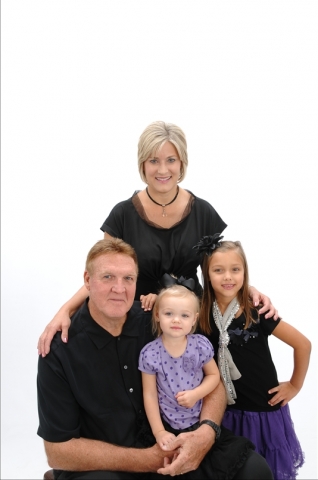 Karen Driessnack Adelman with husband Jan and (L) grandaughters Aynslee (7)and Adriana (2).